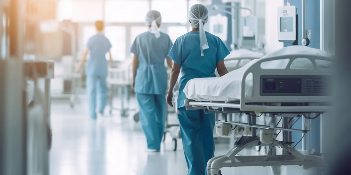 Emergency team moving a patient along the hospital corridor
